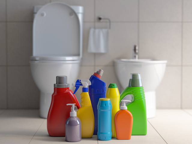 Detergent bottles and containers. Cleaning supplies in wc bathroom toilet interior backgrount. Home cleaning service concept. 3d illustration